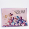 Greeting card with a illustration of a girl surrounded by presents and a heartfelt message on a pink background.