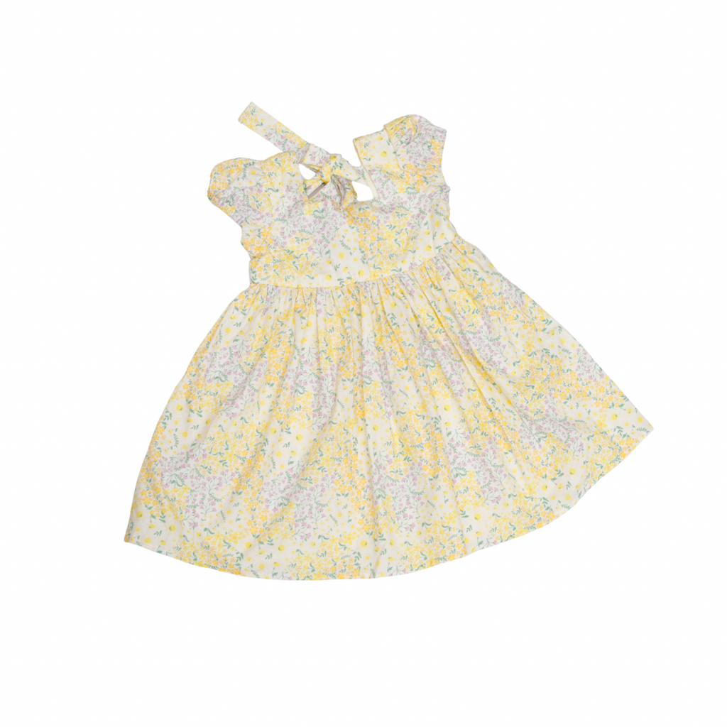Yellow floral dress with matching headband on a white background