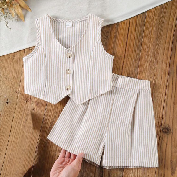Girls Striped vest and shorts set on a wooden surface