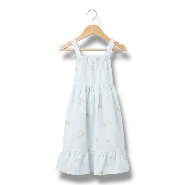 Light blue dress with floral pattern on a wooden hanger against a white background