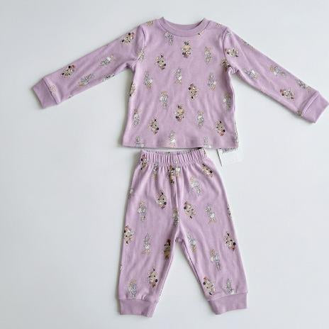Children's pajama set with floral pattern on a light gray background