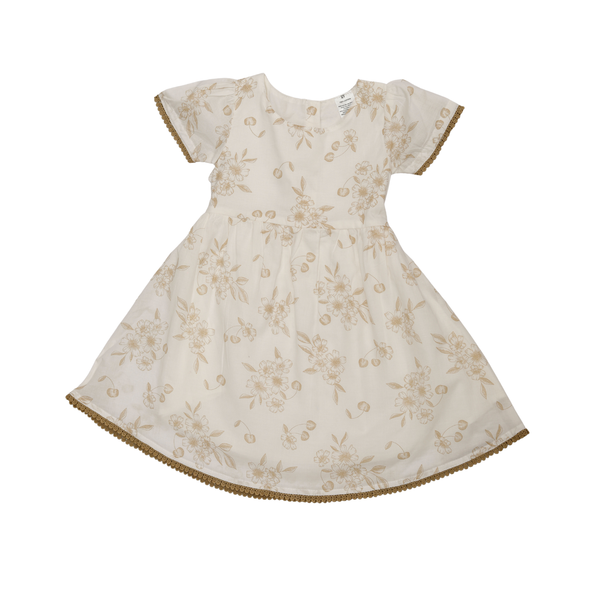 White dress with beige floral pattern on a white background