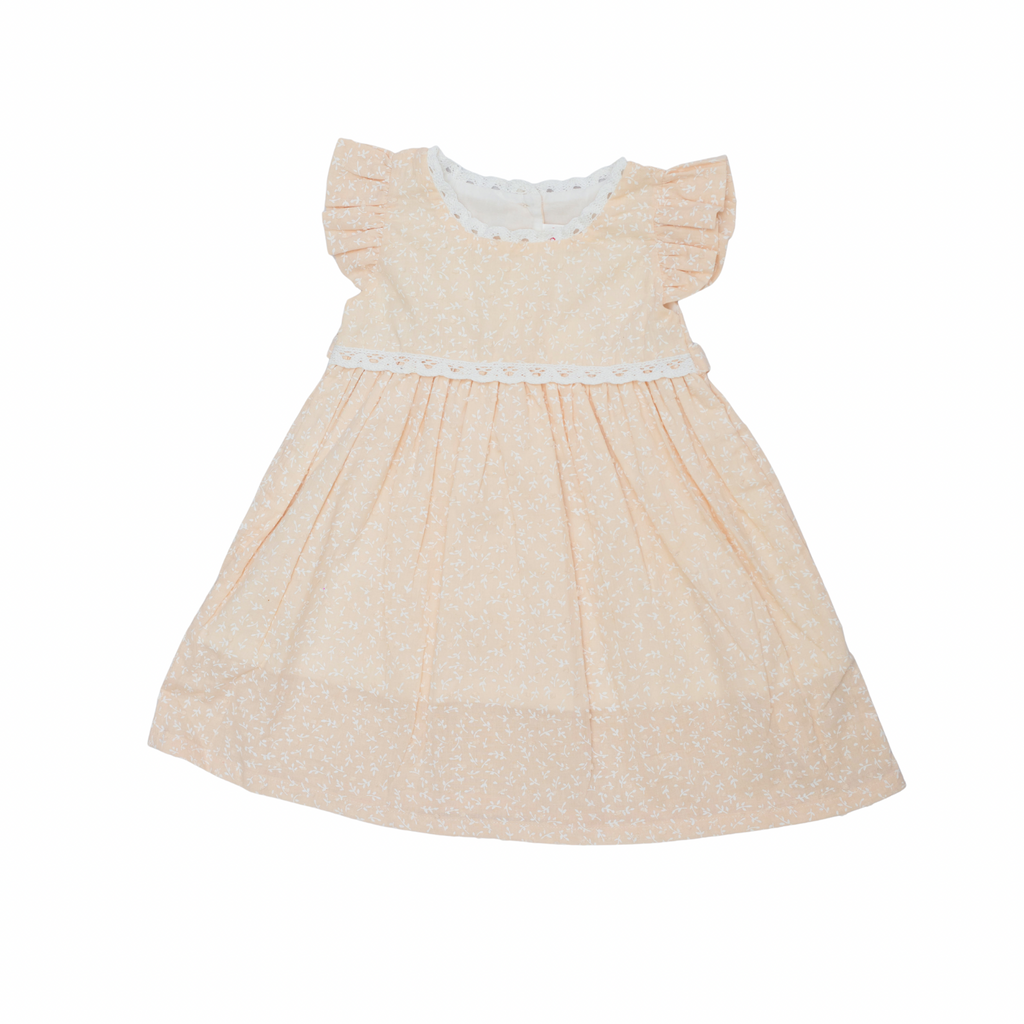Beige dress with white lace details on a white background