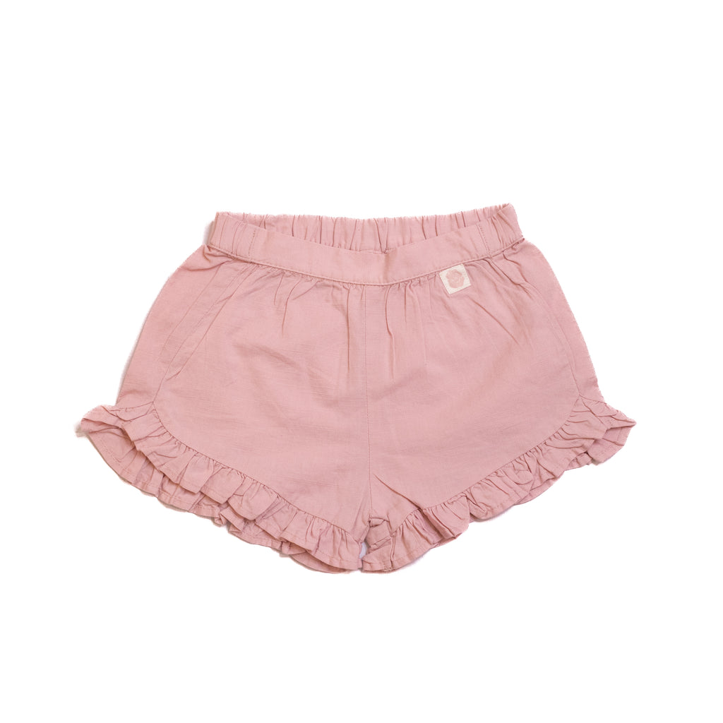 Pink baby shorts with ruffles on a white background