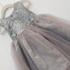 Gray sequin top and tulle skirt dress on a white background