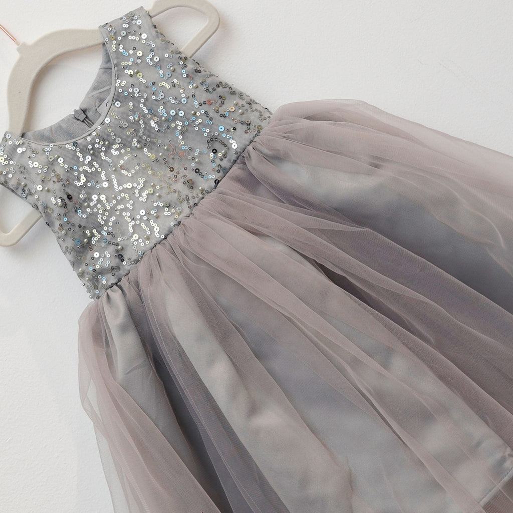Gray sequin top and tulle skirt dress on a white background