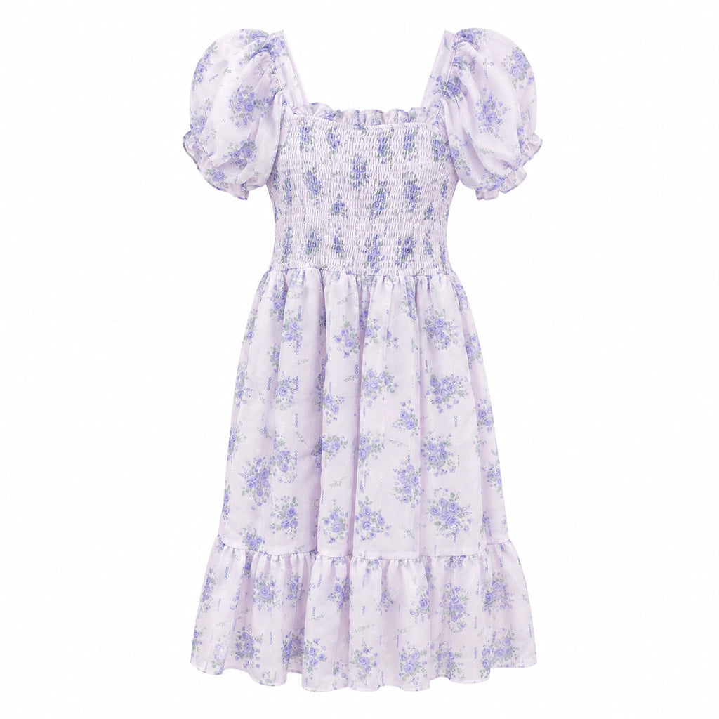 A light lavender and purple floral print dress with puff sleeves, a smocked bodice, and a tiered skirt, shown against a plain white background.