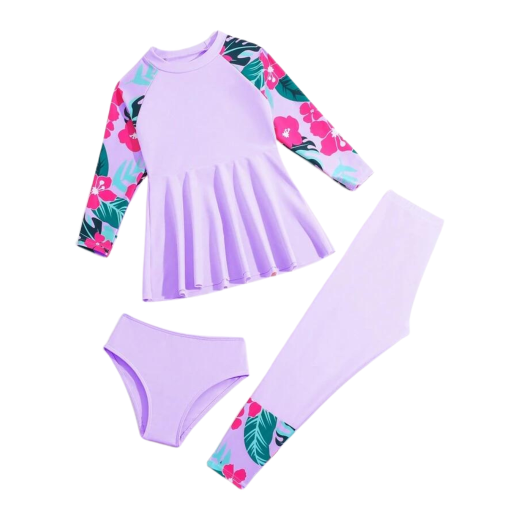 A set of girls' swimwear featuring a long sleeve rash guard with a zipper front, a tankini style top, and matching pants with a floral pattern in purple and pink colors.