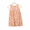 Pink dress with yellow floral pattern on a white hanger
