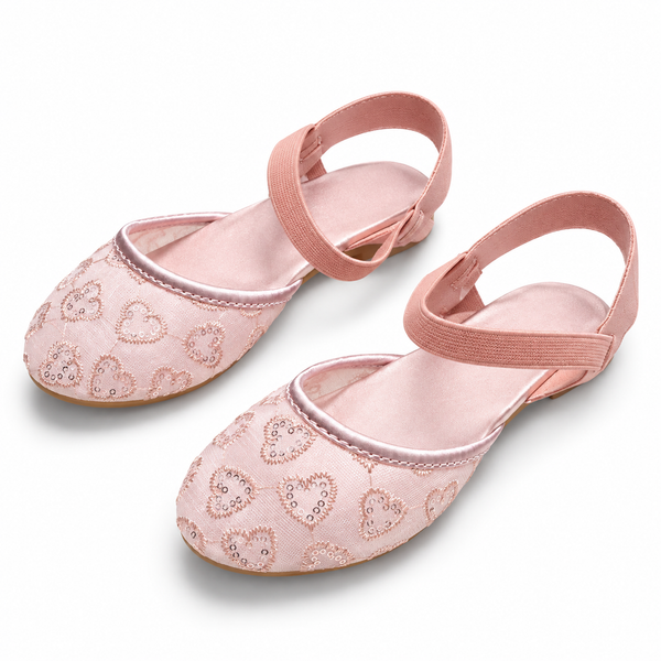 A pair of pink ballet flats with elastic ankle straps and embroidered heart patterns, shown on a clean white background.