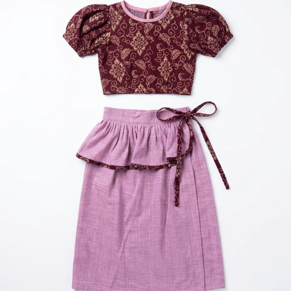Purple top and skirt set with floral pattern on a white background