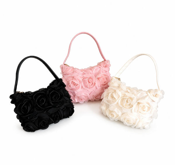 Three floral handbags in black, pink, and white on a white background