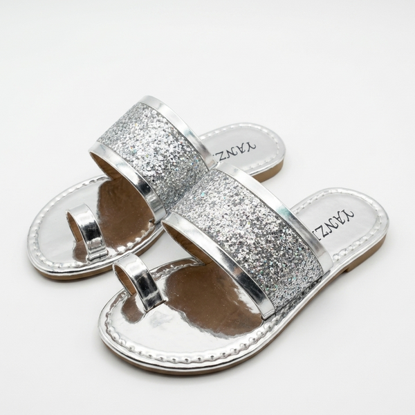 Silver glitter sandals on a white background
