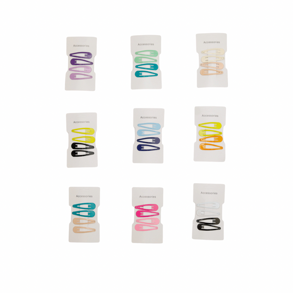 Set of colorful hair ties in white packaging on a white background