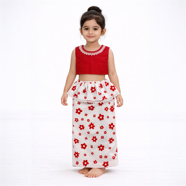 Child wearing a red top and white skirt with red floral pattern on a white background
