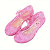Pink glittery shoes on a white background