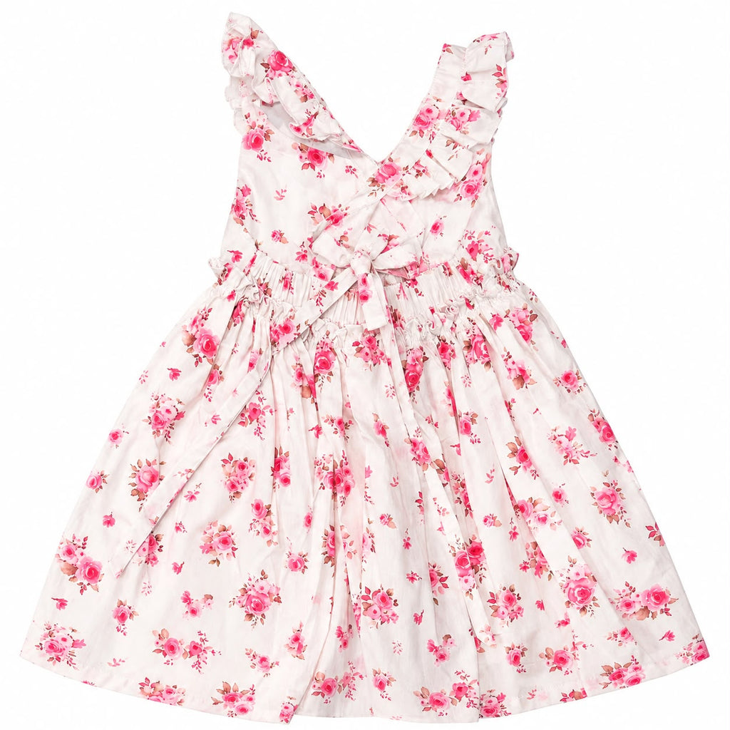 A sleeveless white dress with a pink and red floral print, featuring ruffled shoulder straps, a smocked waist, and a tie detail at the neckline, shown against a plain white background.