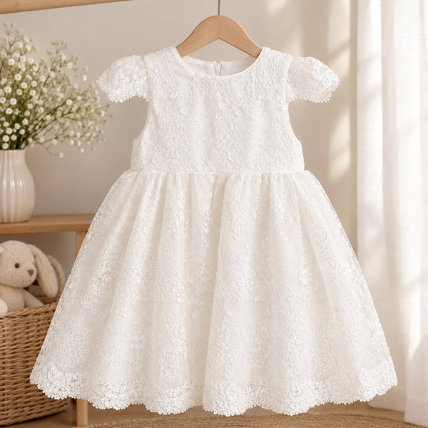 Girls white sleeved lace detailed daisy tulle dress on a plain light background