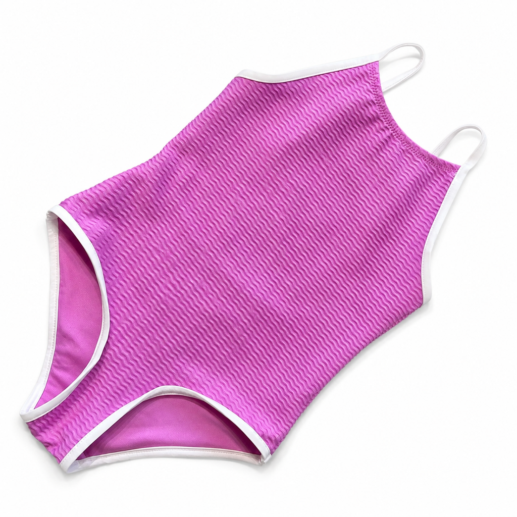 A pink one-piece swimsuit with a textured chevron pattern and white trim, shown flat on a white background.
