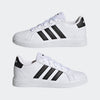 A pair of white Adidas Grand Court Lifestyle Tennis lace-up shoes for kids with black stripes and brand logo on the side.