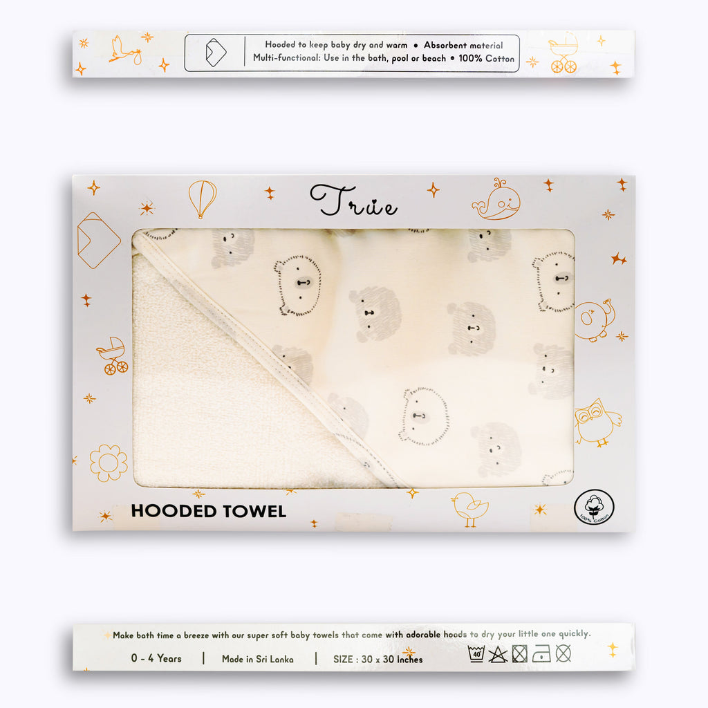 Packaged hooded towel with a pattern of bears and text reading 'Grey Hooded Towel' on the packaging.