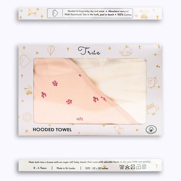 Packaged hooded towel with ladybug design presented in a window box.