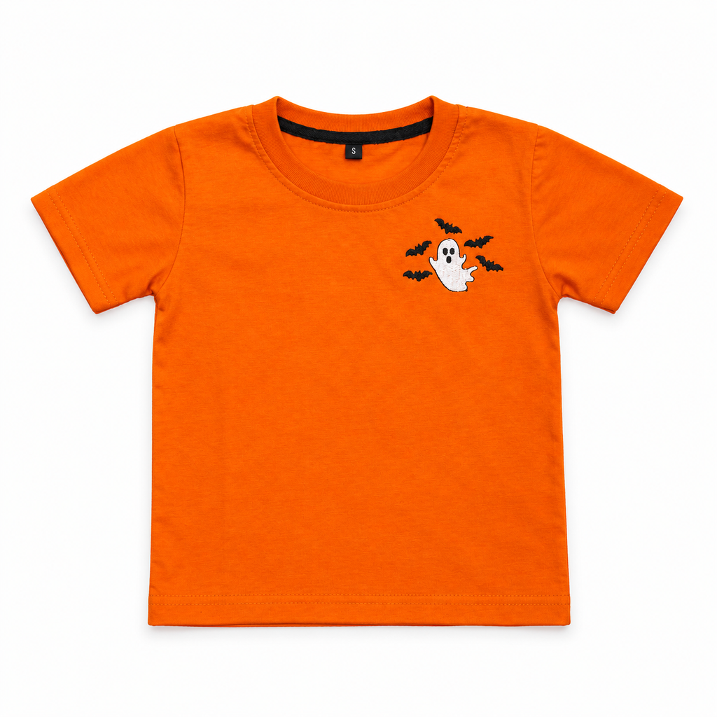 An orange short-sleeve kids' t-shirt with a small Halloween graphic on the left chest featuring a white ghost, black bats, and black spiderwebs, displayed flat against a white background.