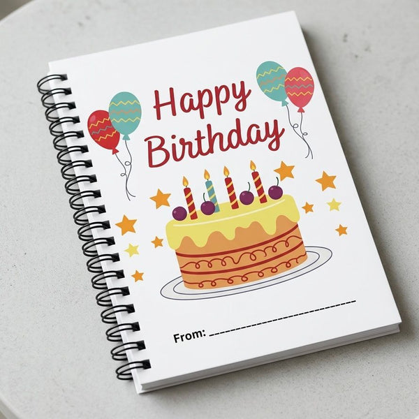 Notebook with a birthday cake illustration and 'Happy Birthday' text on a light gray background