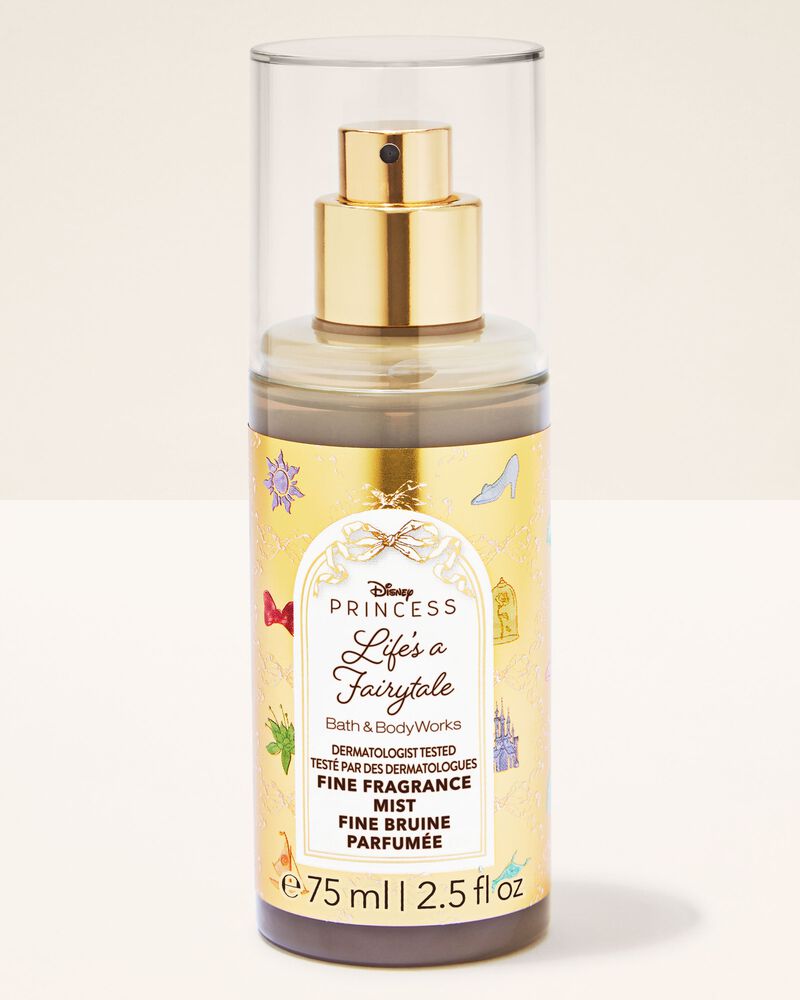 Disney Princess Life's a Fairytale Fine Bruise Mist in a 75 ml spray bottle with a gold pump and clear protective cap, set against a warm cream background.
