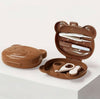 Brown bear-shaped waffle maker on a white surface