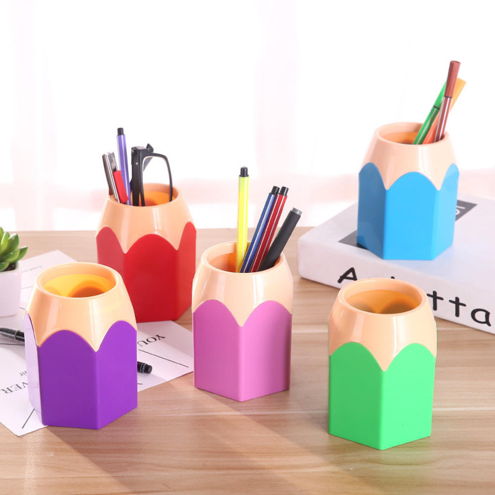 Colorful pencil-shaped pen holders with pens on a wooden surface.