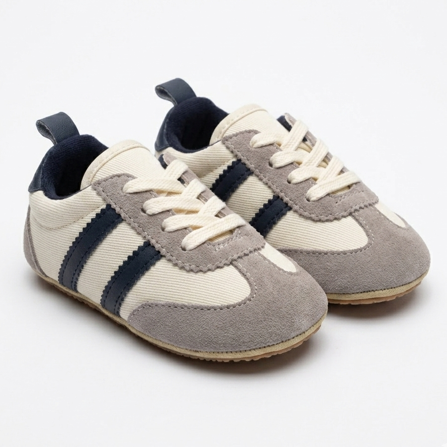 Pair of children's sneakers with navy stripes on a white background