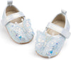 Pair of glittery blue shoes with white bows on a white background