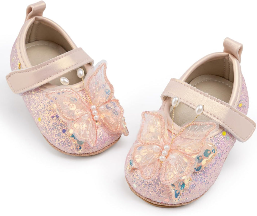 Pair of children's shoes with butterfly designs on a white background