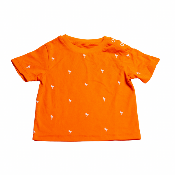 Orange t-shirt with small white patterns on a white background