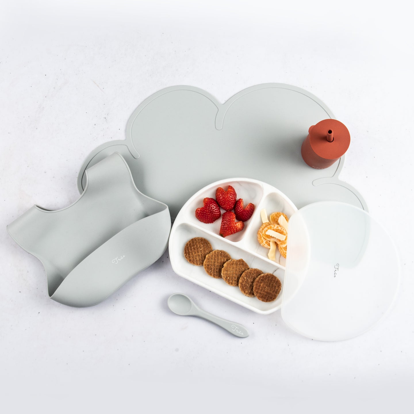 Baby Feeding Essentials: consists of a silicone placemat, divided smile plate, straw cup, bucket bib and spoon.