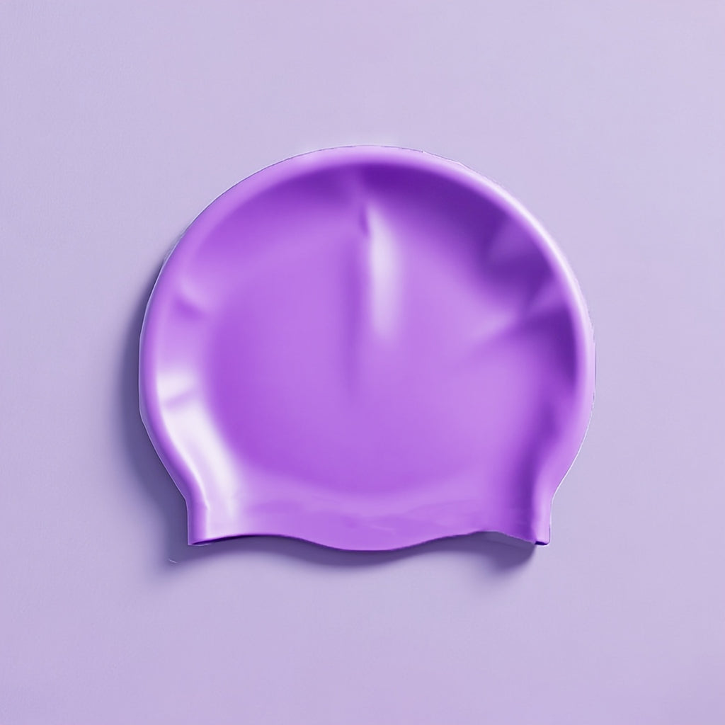 Purple swim cap on a light purple background