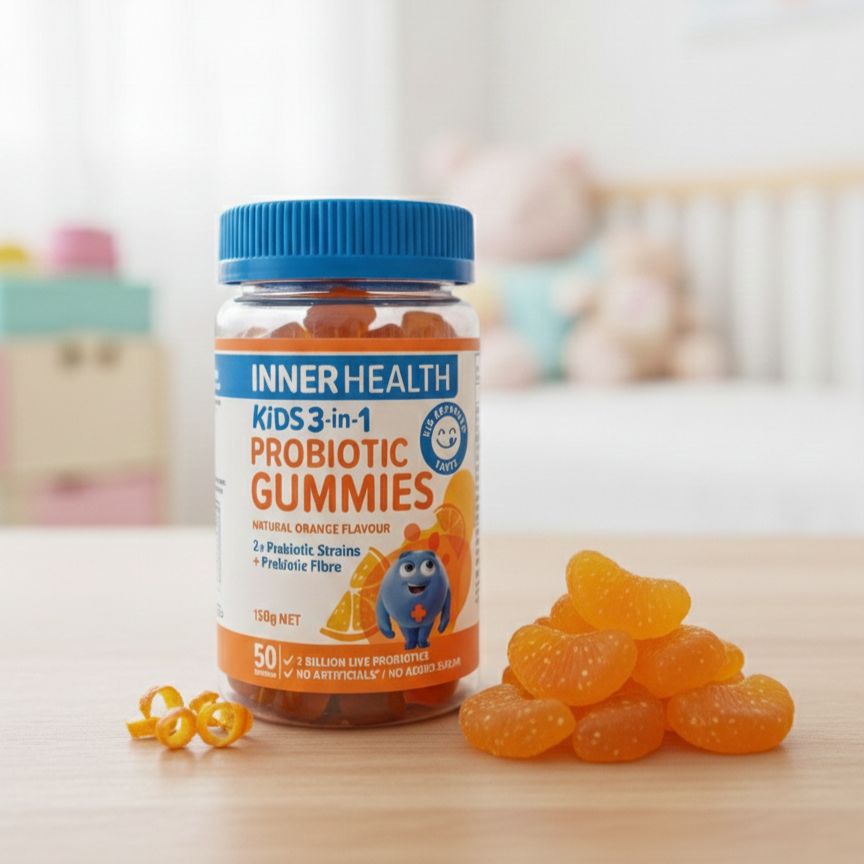 Bottle of Inner Health Kids 3-in-1 Probiotic Gummies on a wooden surface with gummies around.