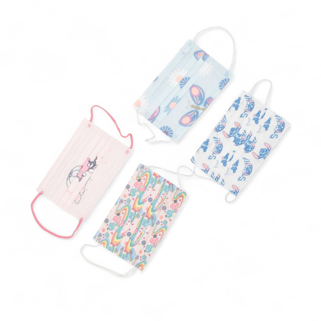 Four colorful face masks with cartoon designs on a white background