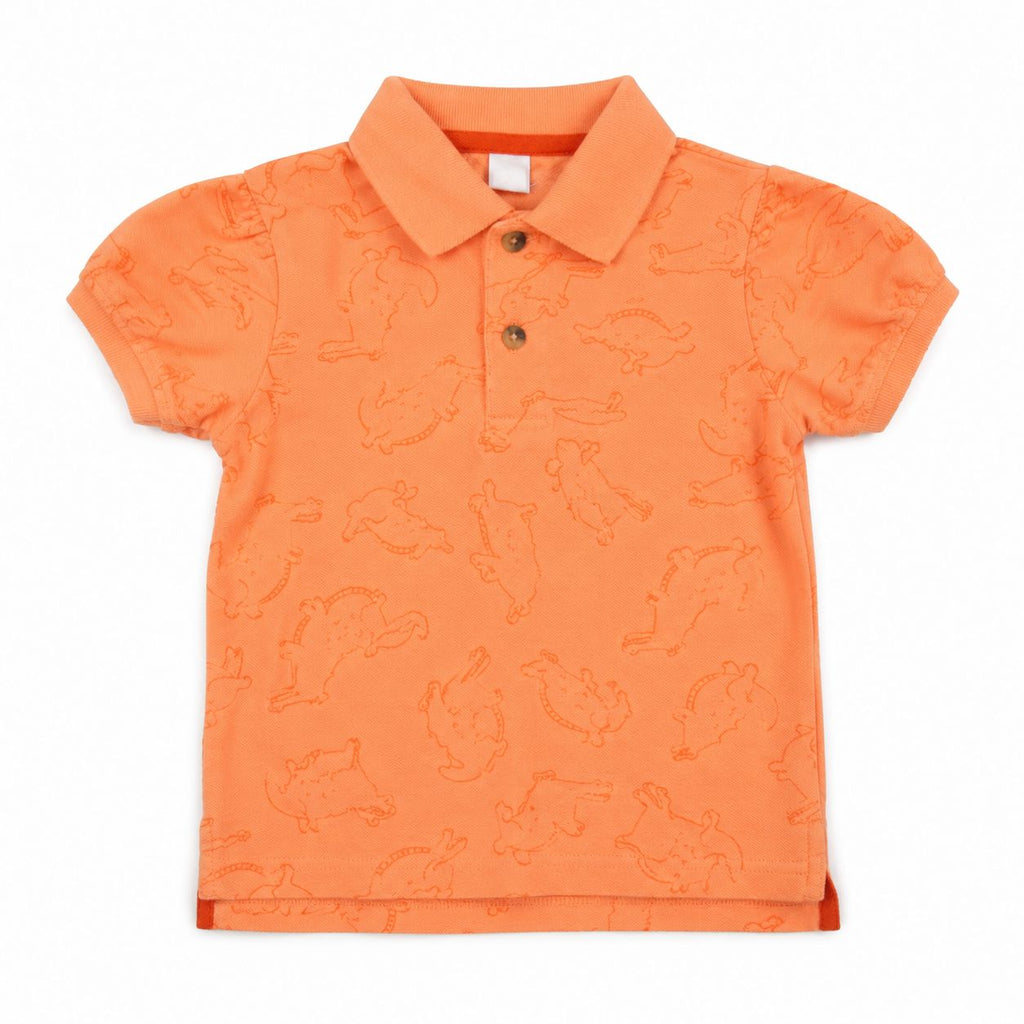 Orange children's polo shirt with animal pattern on a white background