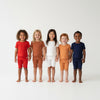 Five children wearing matching outfits in red, brown, white, orange, and blue on a white background