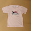 Pink top with cartoon design on a beige background