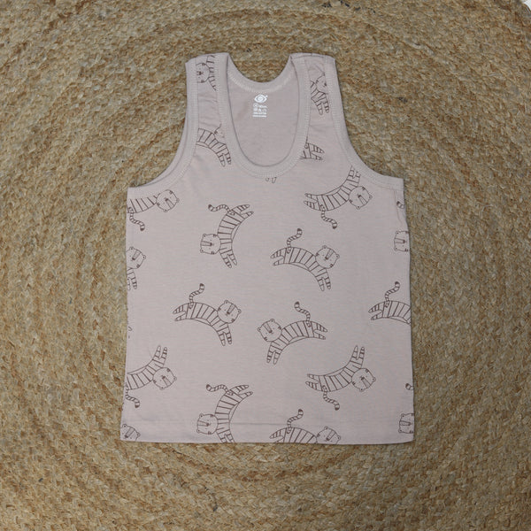 Baby romper with zebra pattern on a textured surface