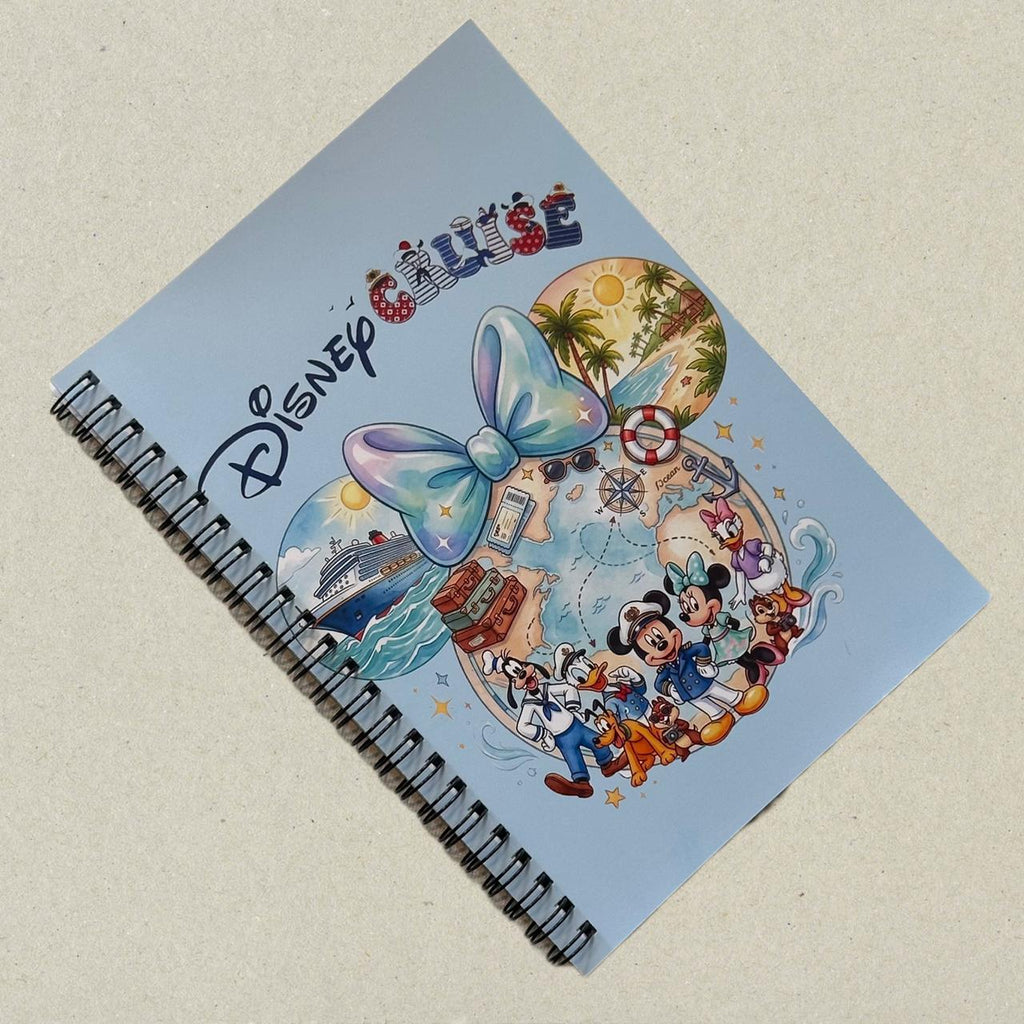 Notebook with Disney Cruise design featuring characters and a bow on a light blue background.
