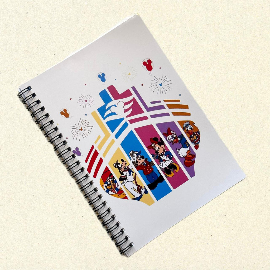 Notebook with colorful character designs on a beige background
