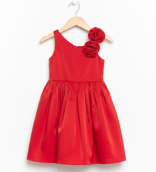 Red dress with floral details on a hanger against a white background