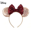 Disney Minnie Mouse style sequin headband with a burgundy sequin bow and rose gold sequin ears on a white background.