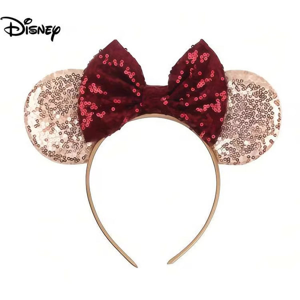 Disney Minnie Mouse style sequin headband with a burgundy sequin bow and rose gold sequin ears on a white background.