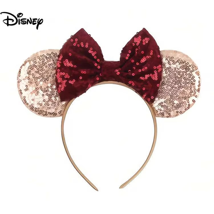 Disney Minnie Mouse style sequin headband with a burgundy sequin bow and rose gold sequin ears on a white background.