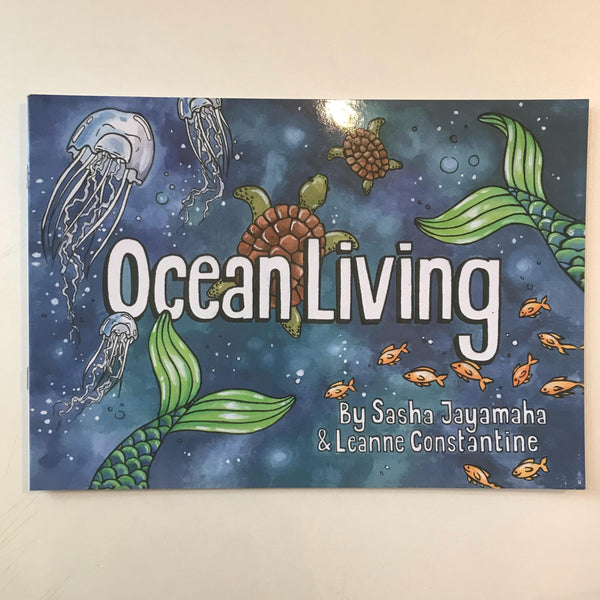 Cover of 'Ocean Living' story and coloring book featuring illustrations of ocean creatures such as jellyfish and turtles, with the authors' names Sasha Jayamaha and Leanne Constantine displayed.